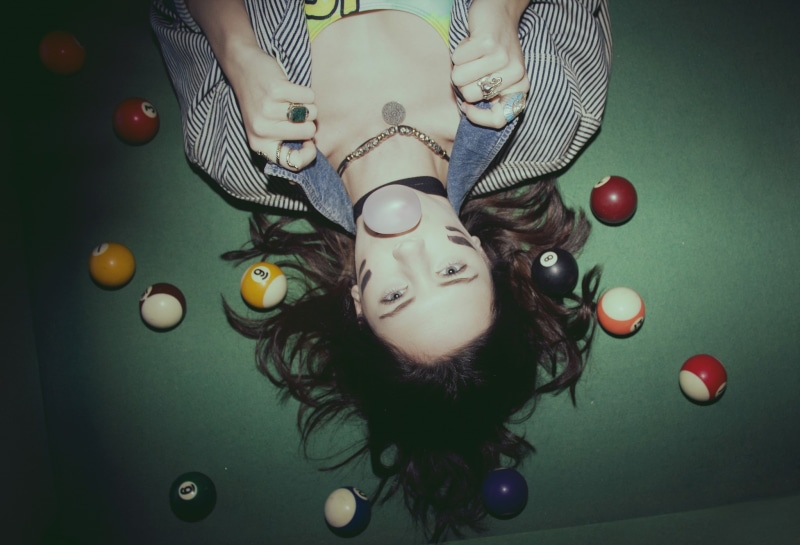 billiard balls, young women, hair, one person, looking at viewer, pool table, contemplation, face paint, beautiful woman, lying down, women, headshot, leisure activity