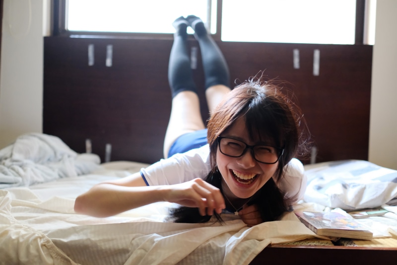 headshot, hairstyle, furniture, girls, home interior, lifestyles, lying on front, childhood, bedroom, indoors, domestic room, leisure activity, school uniform