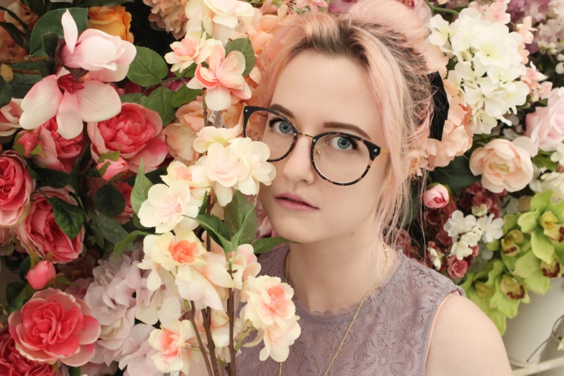 eyeglasses, person, outdoors, freshness, women, hair, adult, bright, colorful, beige, beauty in nature, woman, hairstyle, vulnerability, one person, looking at camera