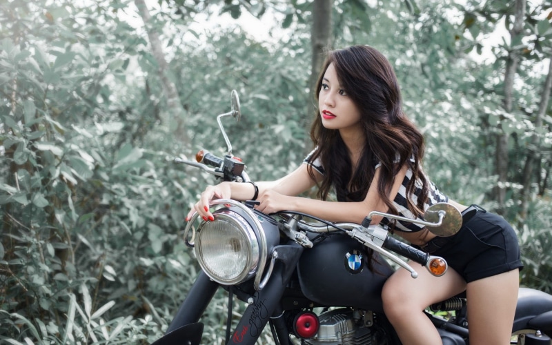 standard, long hair, BMW, young women, shorts, focus on foreground, adult, beautiful woman, beauty, motorcycle, biker, black, mode of transportation, trees
