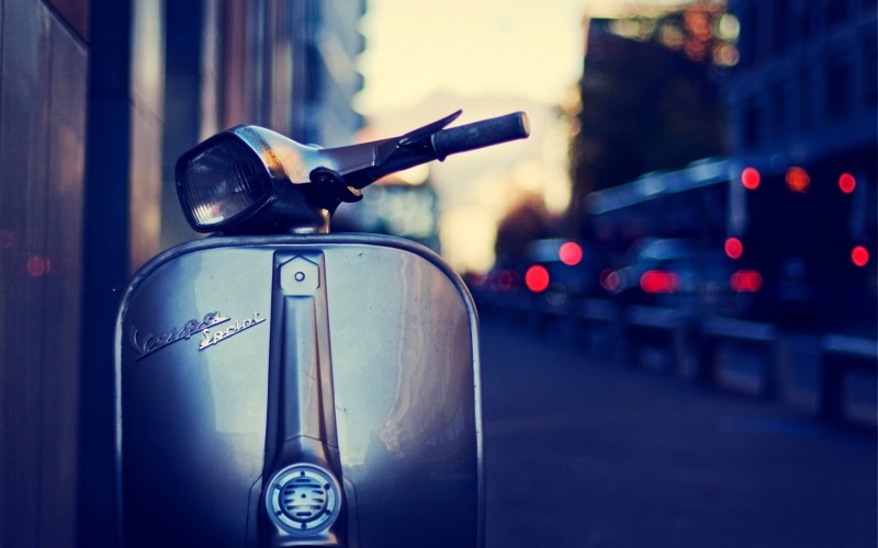 land vehicle, scooters, no people, city life, 1080P, building exterior, road, transportation, architecture, close-up, motor, grey, vehicle mirror, city