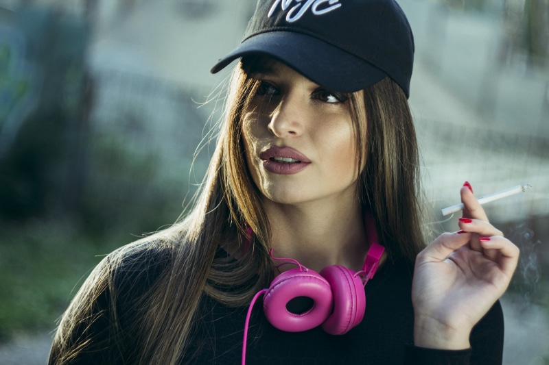 portrait, looking away, smoking, women, smoke, depth of field, red nails, baseball caps, headphones, 1080P, cigarettes