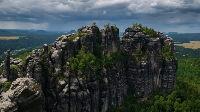 sandstone mountain, beauty in nature, sand stone, elbe schrammsteine, outlook, cloud - sky, gorge, plant, mountains, saxony, rock, tree, ancient civilization