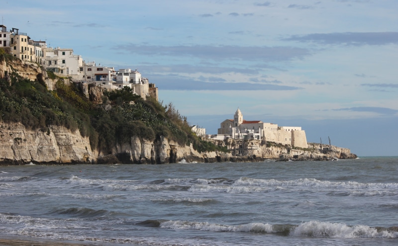 waterfront, old town, promontory, puglia, 4K, building exterior, outdoors, day, cloud - sky, beach, built structure, picturesque, gargano, land, beauty in nature
