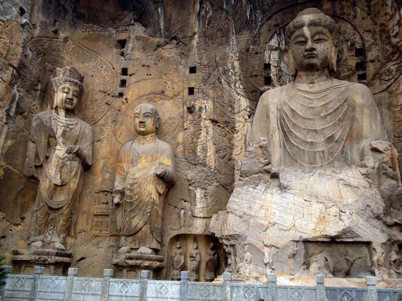 human representation, history, male likeness, tang dynasty, outdoors, people, ancient civilization, pilgrimage, religion, stone carving, the past, buddha