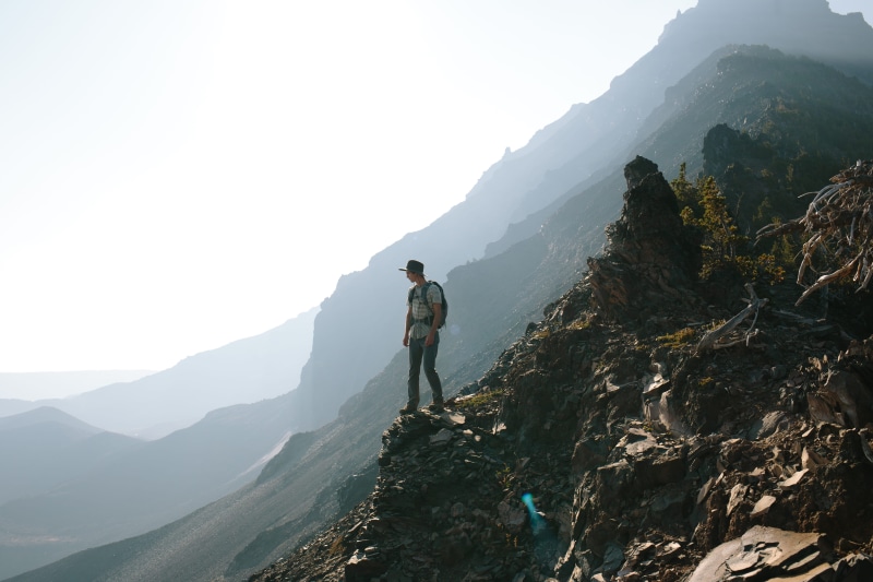 activity, full length, walking, mountain, sky, beauty in nature, mountain range, one man only, monolith, outdoors, adventure, adult, non-urban scene, hike
