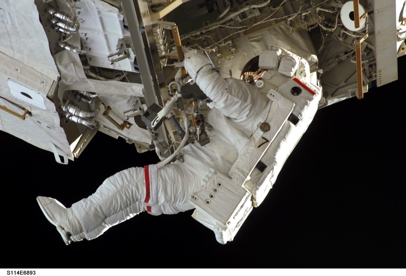 suit, tools, air vehicle, indoors, protection, spacewalk, floating, white color, maintenance, pack, astronaut, industry, adult, tether, occupation, expertise