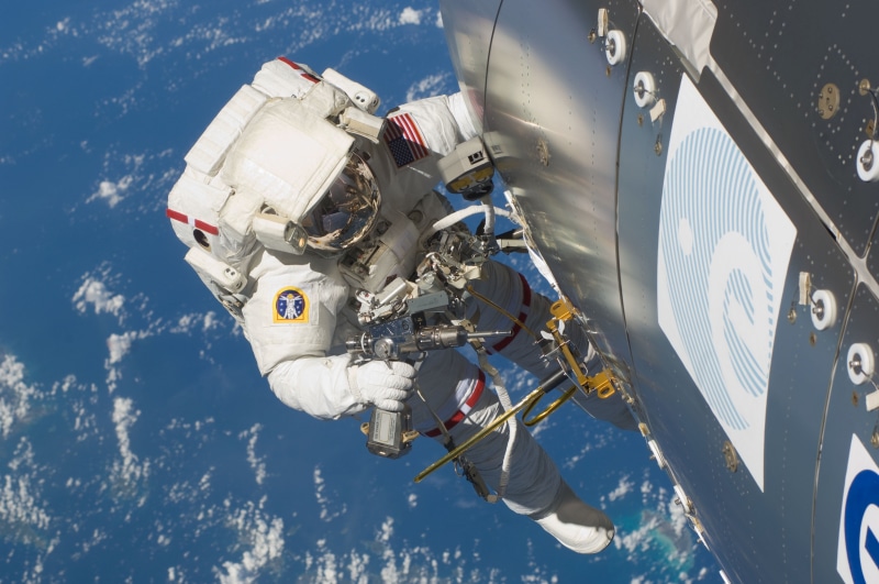 aerospace industry, headshot, sky, outside, robot, day, high angle view, extra-vehicular activity, pack, transportation, astronaut, iss, adult, station