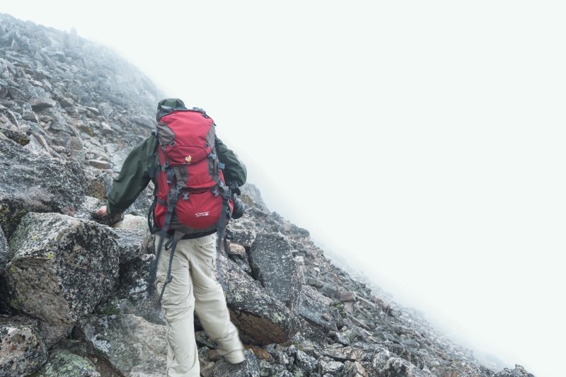winter, rock - object, mountain climbing, red, outdoors, nature, fitness, one man only, solid, mountain, rocks, beige, wearing, day, fog, adventure, full length