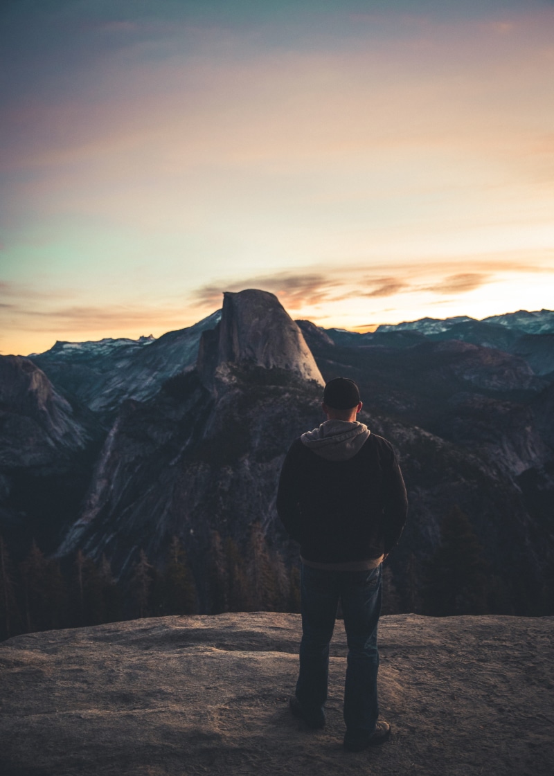 adventure, sunrise - Dawn, rock, nature, sunlight, outdoors, tourist, mountain, standing, adult, formation, 5K, journey, looking, sky, night, lifestyles