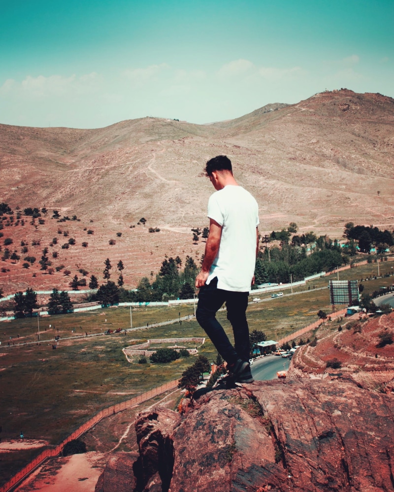 trees, landscape, nature, mountain, real people, climber, leisure, white, environment, outdoors, young adult, back view, casual clothing, one person, lifestyles