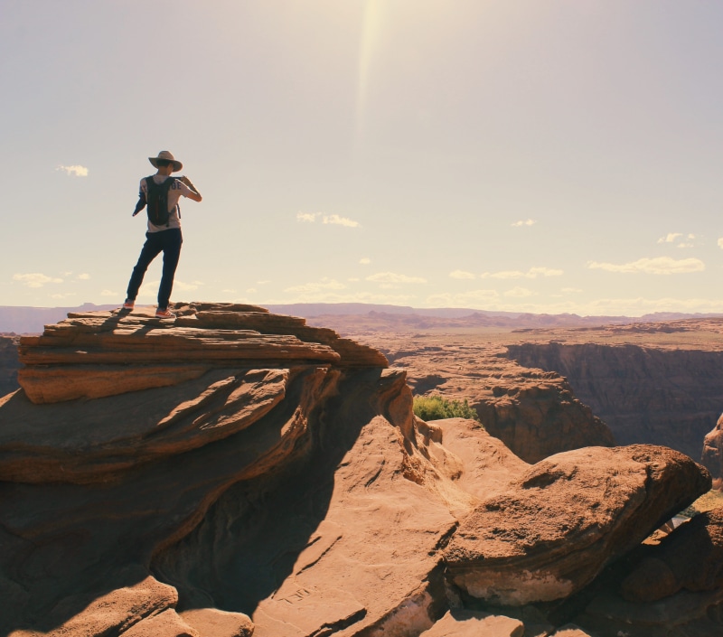 birds, hike, hiker, full length, climb, rock formations, looking at view, non-urban scene, clouds, mountain, adventure, real people, adult, landscape, high