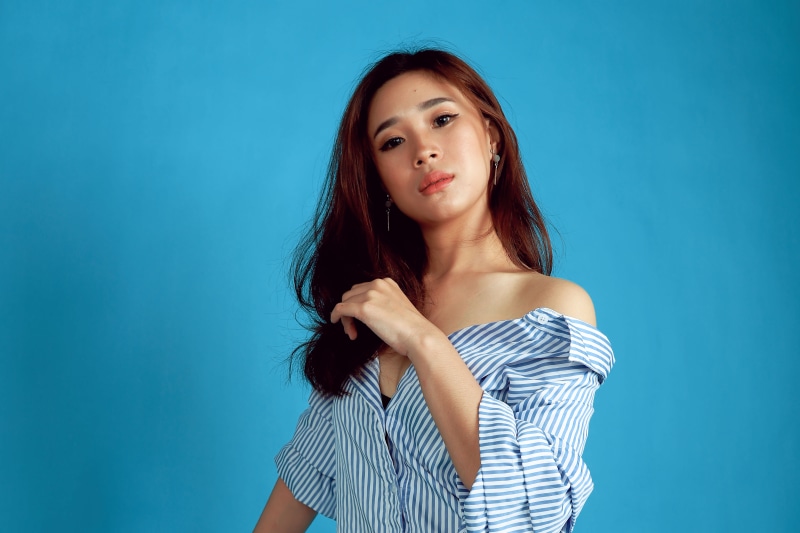 long hair, close-up, s, model, female, facial expression, photoshoot, fashion, beautiful woman, woman, blue background, beautiful, portrait, blue jeans