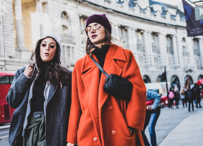 warm clothing, real people, woman, city life, front view, architecture, beautiful woman, street, lifestyles, women, clothing, young women, standing, wearing