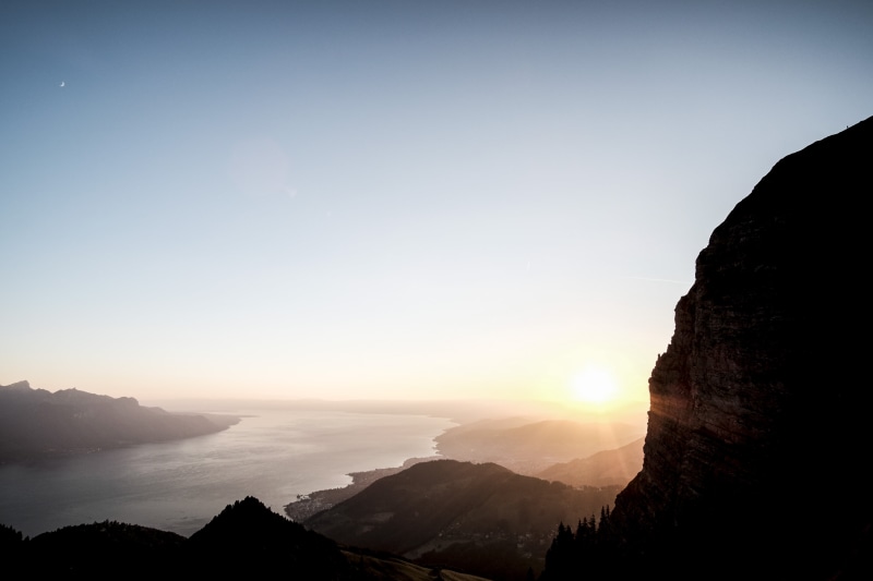 shadows, dawn, sunlight, clouds, sea, sun, outdoors, remote, scenics, trees, rock - object, light, slihouette, snow, mountain range, hill, mountain, photo