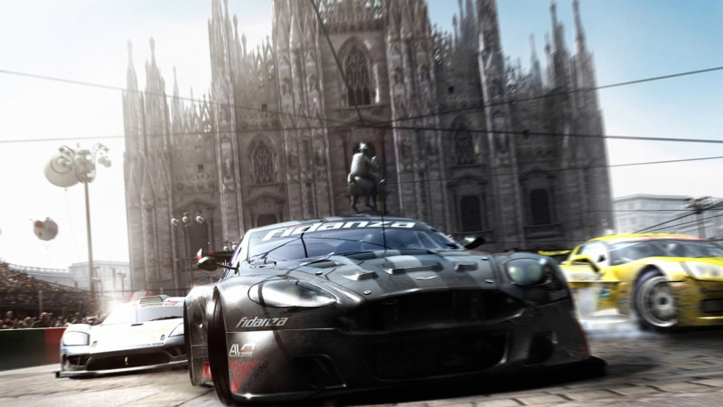 motor vehicle, Race Driver: GRID, outdoors, 1080P, street, infront, Aston Martin, nature, built structure, day, traffic, helmet, travel, incidental people