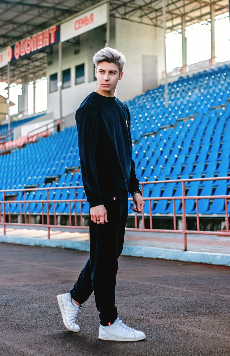 portrait, young adult, focus on foreground, confidence, man, stadium, looking at camera, architecture, full length, one person, infront, day, lifestyles