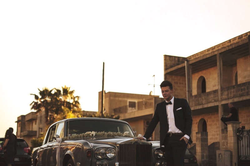 businessman, love, suit, luxury, rolls royce, decorated, floral, male, well-dressed, built structure, oldtimer, sky, building exterior, land vehicle, street
