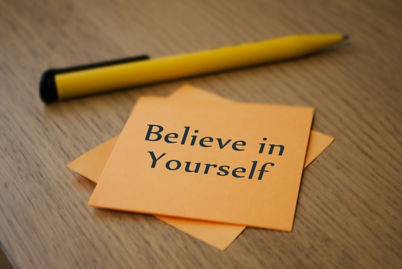 table, focus on foreground, close-up, high angle view, single Word, paper, text, words, sign, sticky, wood - Material, concepts, communication, ideas, yellow