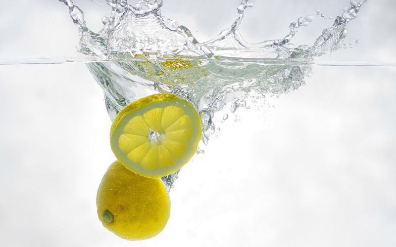 no people, underwater, floating on water, food, close-up, slice, 1080P, lemon, refreshment, water, wellbeing, sliced, purity, studio shot, splashing, freshness