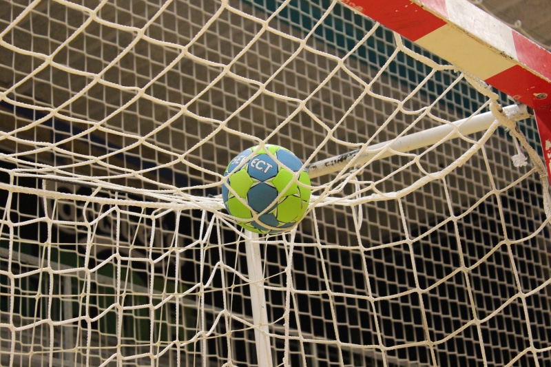 shape, outdoors, hall, protection, soccer, sign, soccer ball, high angle view, team sport, day, green, blue, white, representation, no people, security