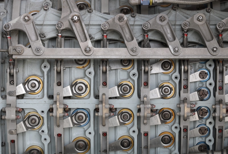 side by side, electrical equipment, technology, connection, metal, still life, indoors, museum, no people, close-up, turbine engine, silver colored, large group of objects