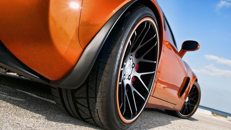 motor vehicle, travel, tire, no people, 1080P, metal, orange color, sunlight, nature, sky, mode of transportation, Chevrolet Corvette, orange, transportation
