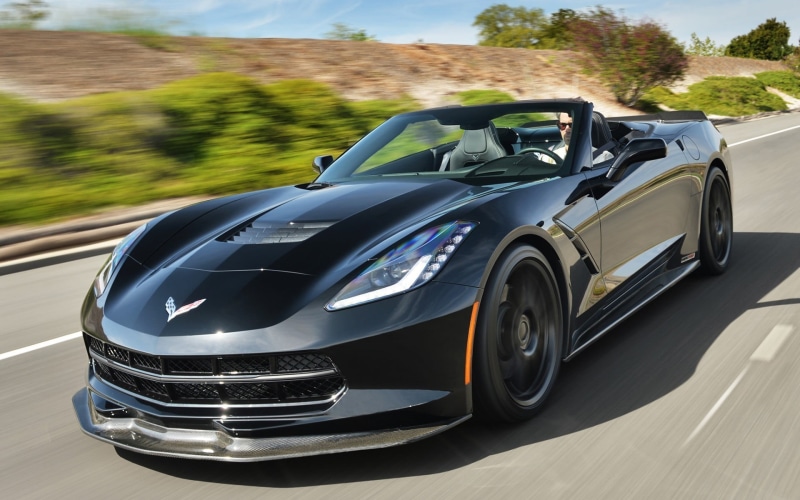 chrome, no people, convertible, outdoors, car, land vehicle, motion, sunlight, vehicle, luxury, speed, corvette, silver colored, mode of transportation