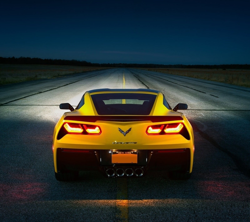 sign, no people, coupe, illuminated, road, yellow, chevrolet, motion, taxi, sky, transportation, mode of transportation, speed, sports, land vehicle, road trip