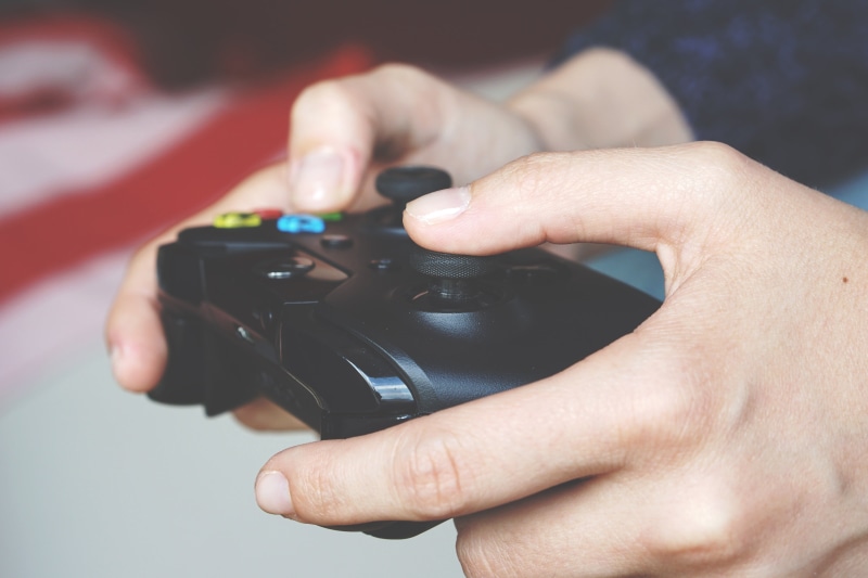 game, wireless technology, controller, play, slr camera, camera, focus on foreground, computer games, photographic equipment, hand, modern, equipment, camera - Photographic Equipment