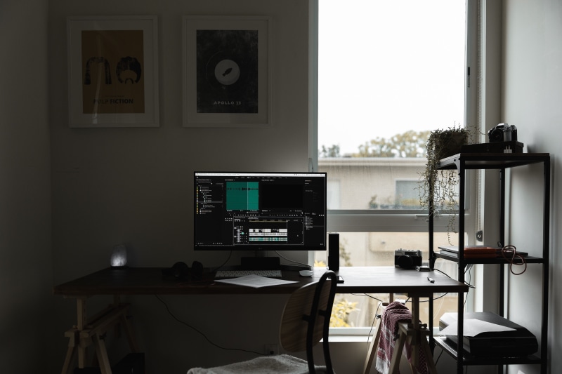 table, pc, electric lamp, computer equipment, no people, shelf, picture frame, room, furniture, connection, wall - building feature, home office, machine