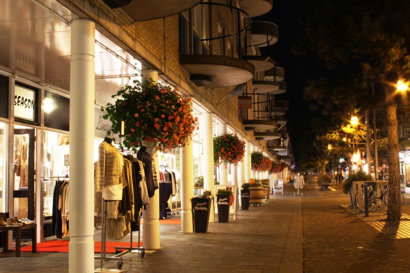 footpath, nature, shopping mall, built structure, plant, street light, building, lit, night, late night shopping, city, direction, lighting equipment, the way forward