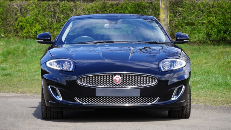 vehicle, no people, auto, black, coupe, land vehicle, motor, motor vehicle, power, race, jaguar xk, stationary, tire, luxury, blue, transport, road, nature