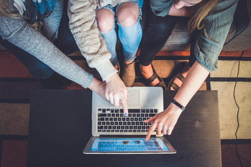 air, person, casual clothing, people, macbook, human hand, wireless technology, table, laptop, lifestyles, internet, sitting, hand, working, screen, three