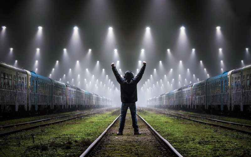 full length, direction, transportation, real people, standing, human arm, rail transportation, train, vehicle, railroad track, casual clothing, men, limb