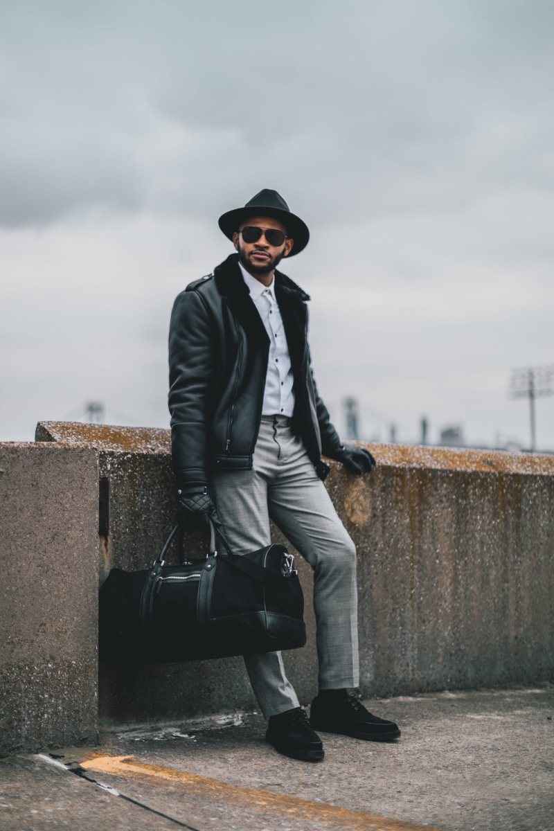 business, wall, outdoors, clothing, standing, duffle, bag, architecture, one person, men, day, young men, man, young adult, 5K, full length, real people