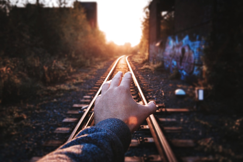 day, diminishing perspective, direction, lifestyles, personal perspective, people, mode of transportation, human body part, sunlight, railroad Track, human hand
