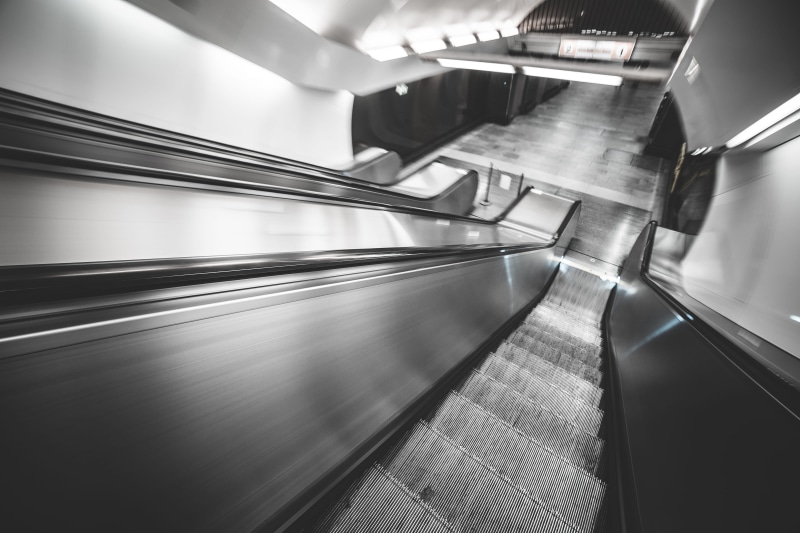 built structure, one person, silver colored, city Life, no people, human hand, Motion, moving walkway, blurred Motion, corridor, commuter, transportation