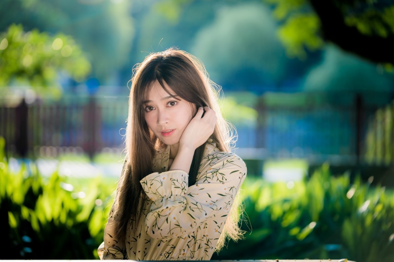 Flower Dress, grass, depth of field, women, trees, model, Asian, Bushes, 4K, railing, brunette, long hair, hand on face, looking at viewer