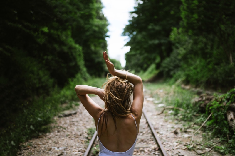human arm, tree, hairstyle, chill, hair, women, dance, 5K, woman, rail, stand, railway, land, real people, travel, day, forest, train, expression, adult