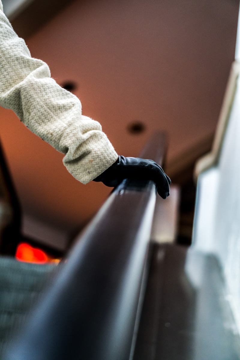 land vehicle, one person, transportation, day, lifestyles, human hand, handrail, human body part, real people, holding, railing, salt lake, handle, hand