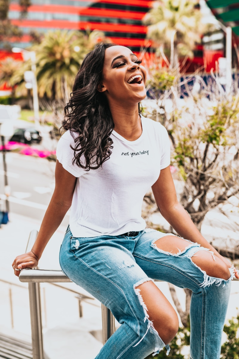lady, young adult, candid, woman, real people, lifestyles, leisure activity, young women, laughing, happiness, model, smile, plant, looking, white shirt