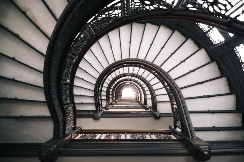 railing, the way forward, white, metal, absence, steps and staircases, spiral, black, arch, no people, low angle view, Chicago, directly below, spiral staircase
