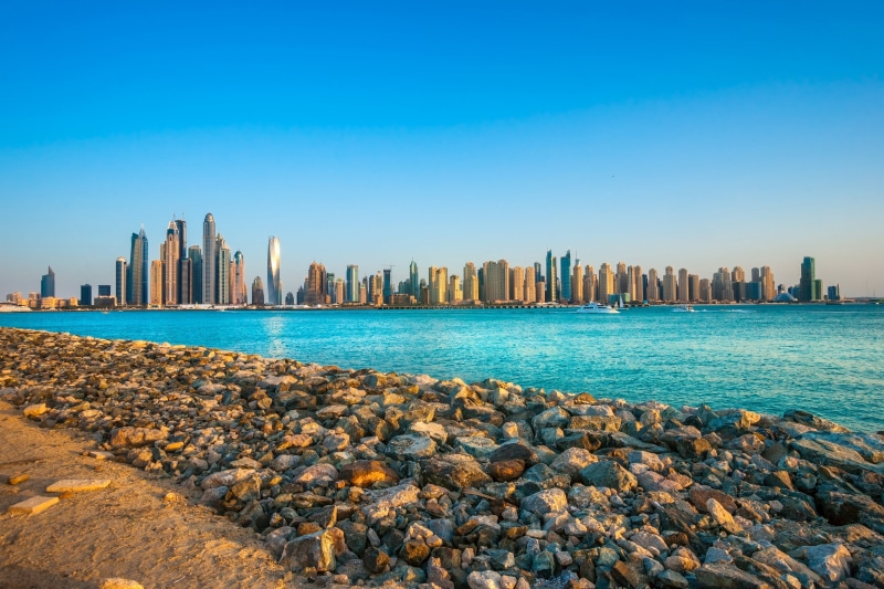 beach, rock, blue, sea, groyne, photography, built structure, solid, urban skyline, building exterior, skyscraper, water, Dubai, outdoors, city, architecture