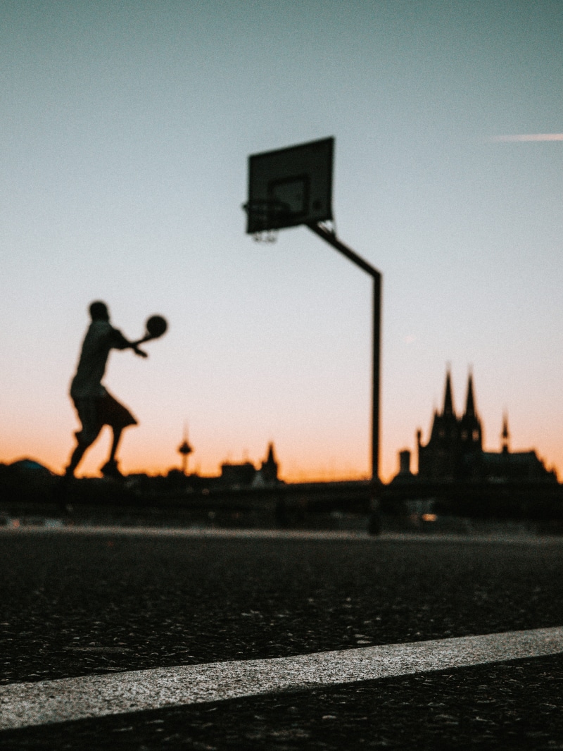 young Adult, jump, two People, fun, silhouette, ball, court, men, sky, near, urban, street, sport, portable, outdoors, lifestyles, line, people, holding