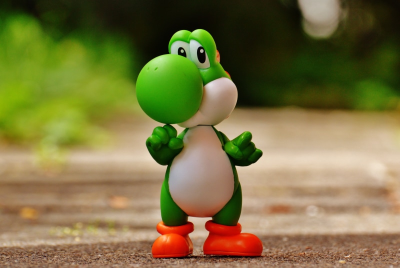 plastic, plant, yoshi, retro, children, toy, land, nintendo entertainment system, outdoors, focus on foreground, cute, happy, close-up, figure, classic
