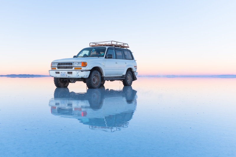 copy space, wander, travel, nature, flats, sky, salar de uyuni, lake, clouds, bolivia, sea, nissan, transportation, environment, motor vehicle, parked