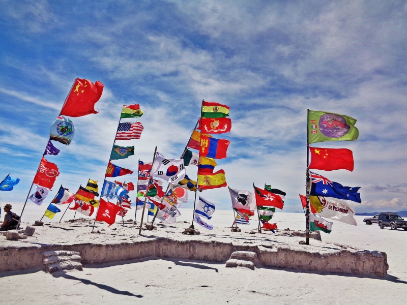 wind, summer, sunlight, flags, sea, multi colored, blue, nature, day, environment, in a row, the salar de uyuni, patriotism, land, assorted, no people