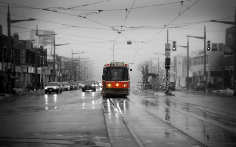 selective coloring, rainy season, city street, cable car, railroad track, transportation, urban, motor vehicle, tram, city, built structure, outdoors, street