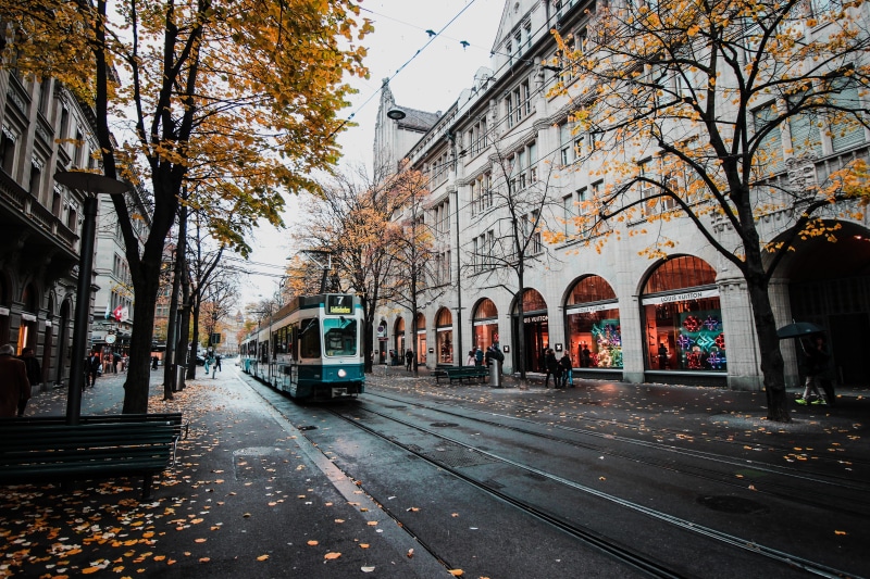 day, bahnhofstrasse, outdoors, europe, train, rail transportation, autumn, building exterior, road, daylight, city, track, architecture, transportation system